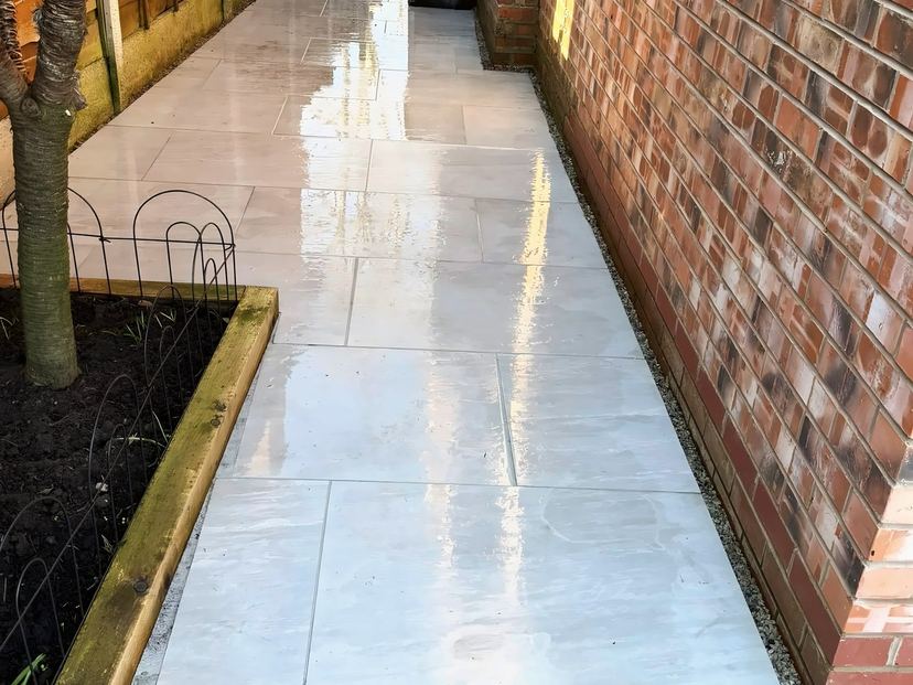 Side path after jet washing, the slabs clean and still wet
