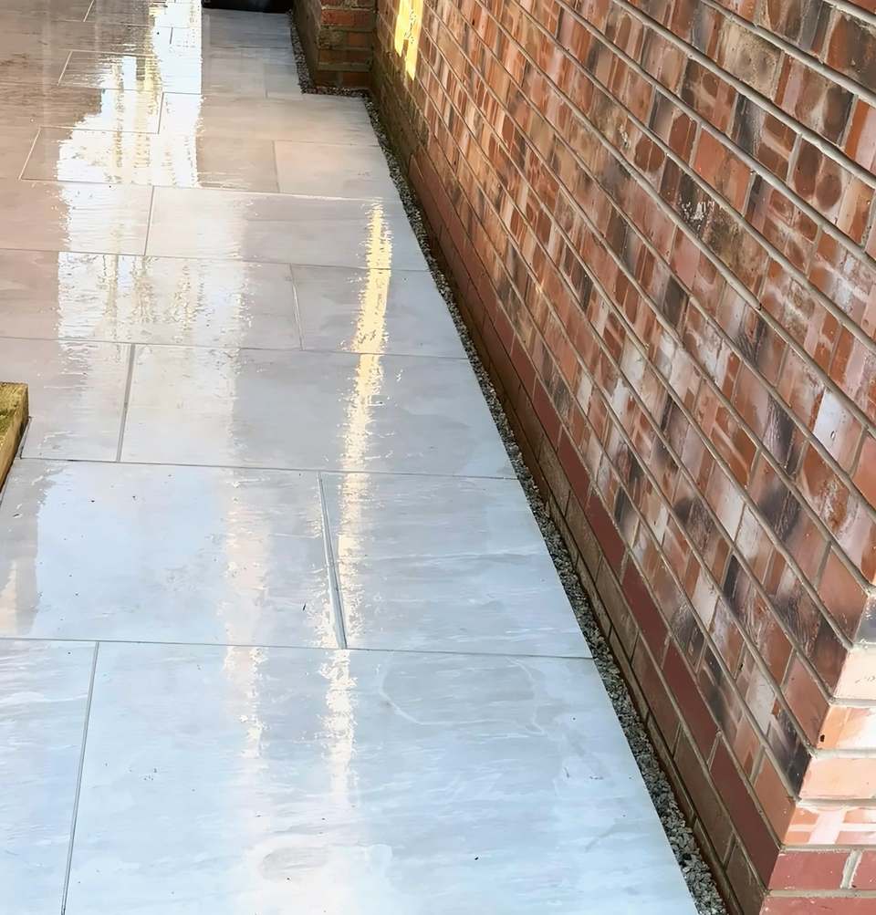Side path after jet washing, the slabs clean and still wet